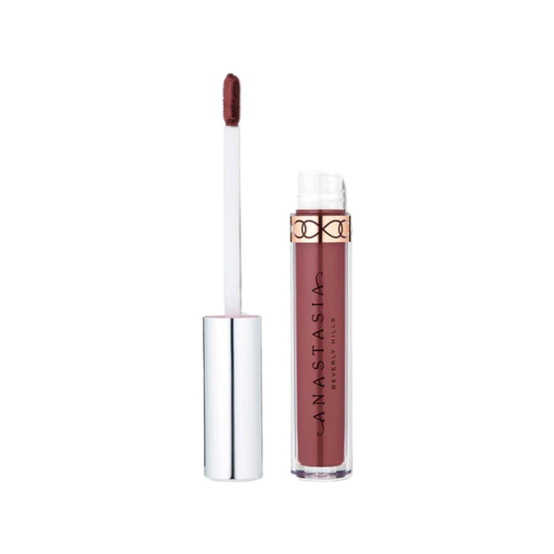 Lip gloss with applicator on a white background