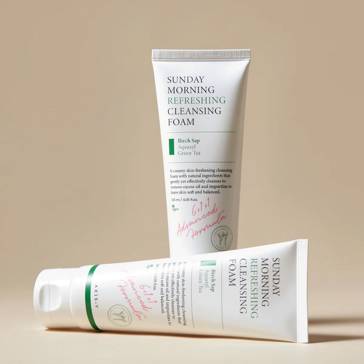 Two tubes of Sunday Morning Refreshing Cleansing Foam on a beige background