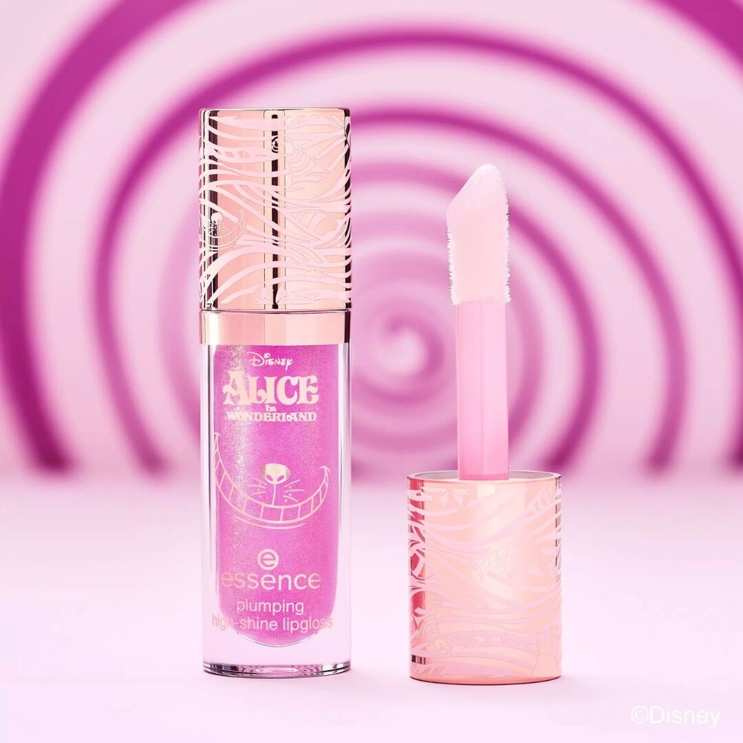 Lip gloss and lip balm with 'Alice in Wonderland' theme on a pink spiral background
